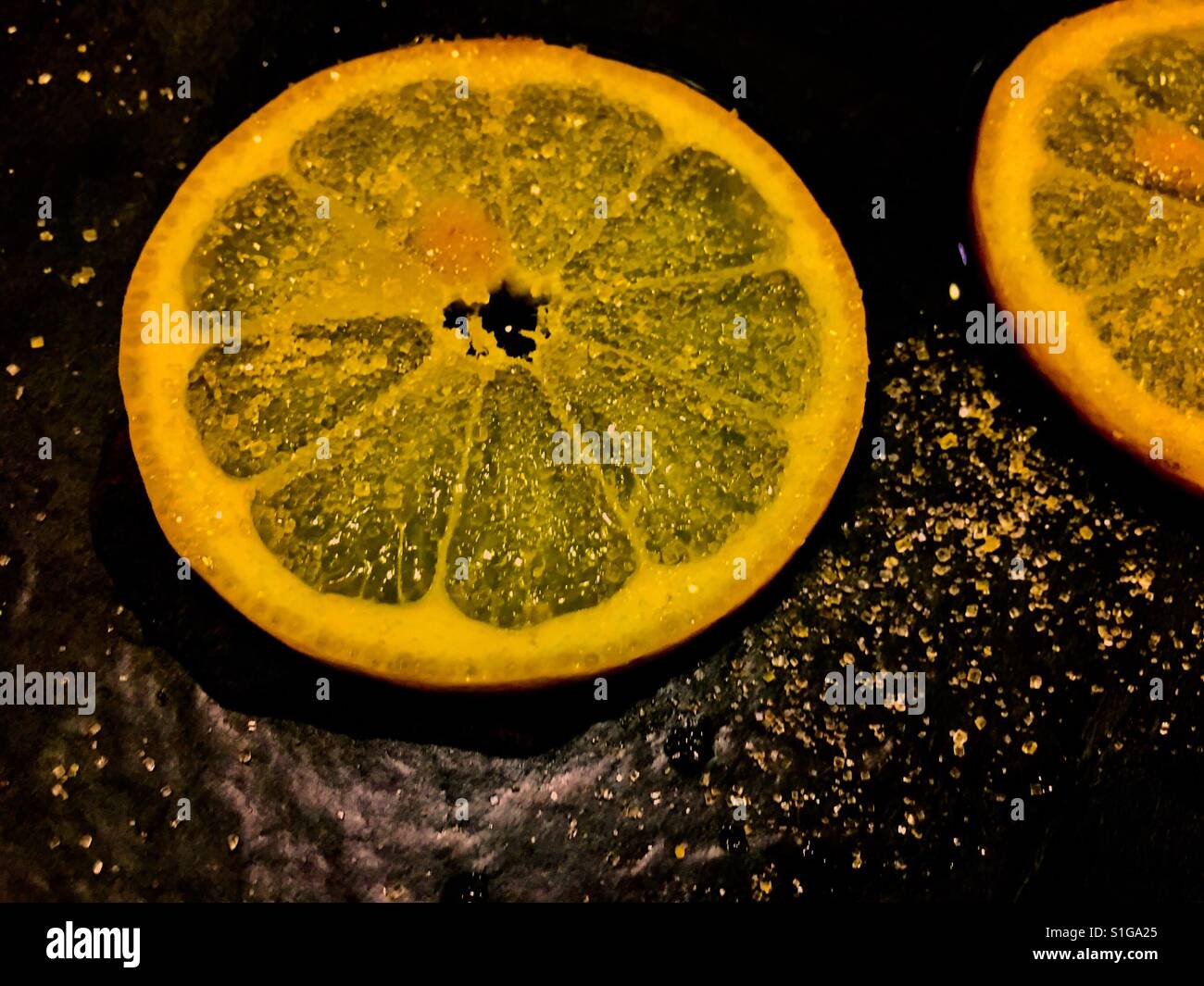 Orangenscheibe und Zucker bestreut Stockfoto