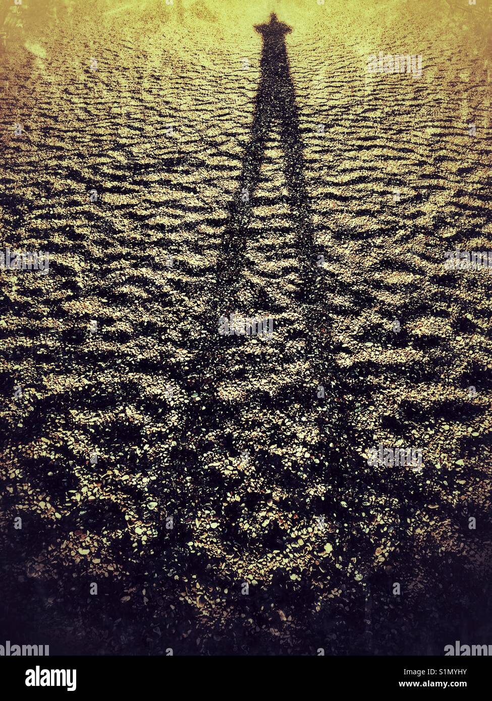Schatten am Strand Stockfoto