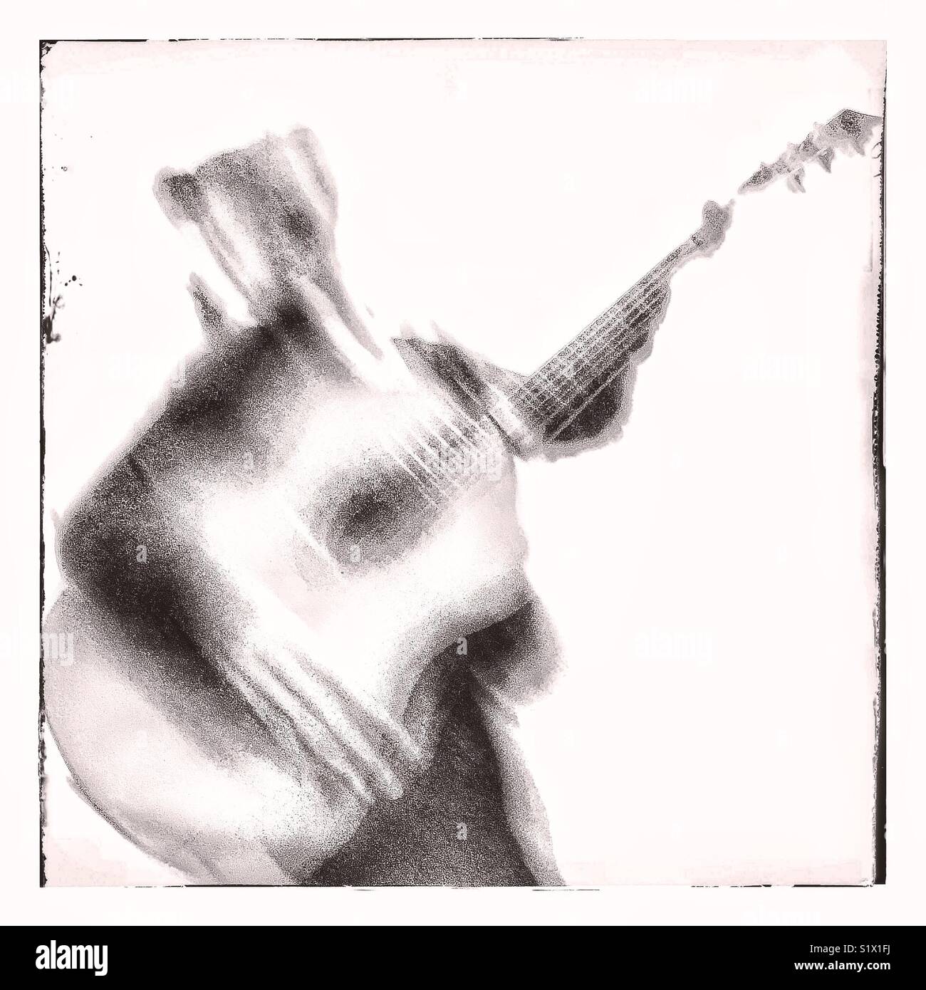 Verschwommenes bild Spielen einer Gitarre. - Smartphone-aufgenommenes Stockfoto