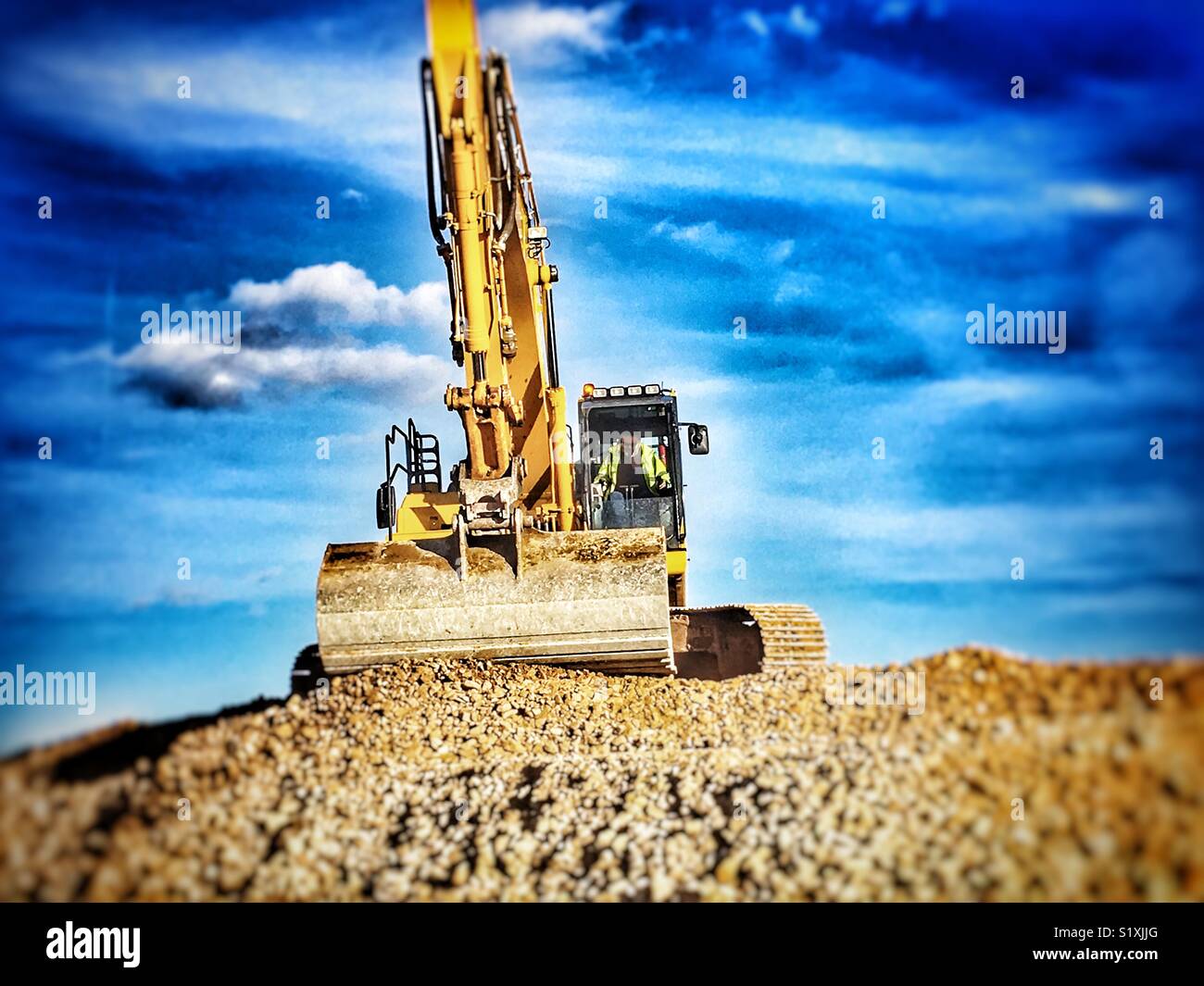 Komatsu mechanische Digger - Smartphone-aufgenommenes Stockfoto