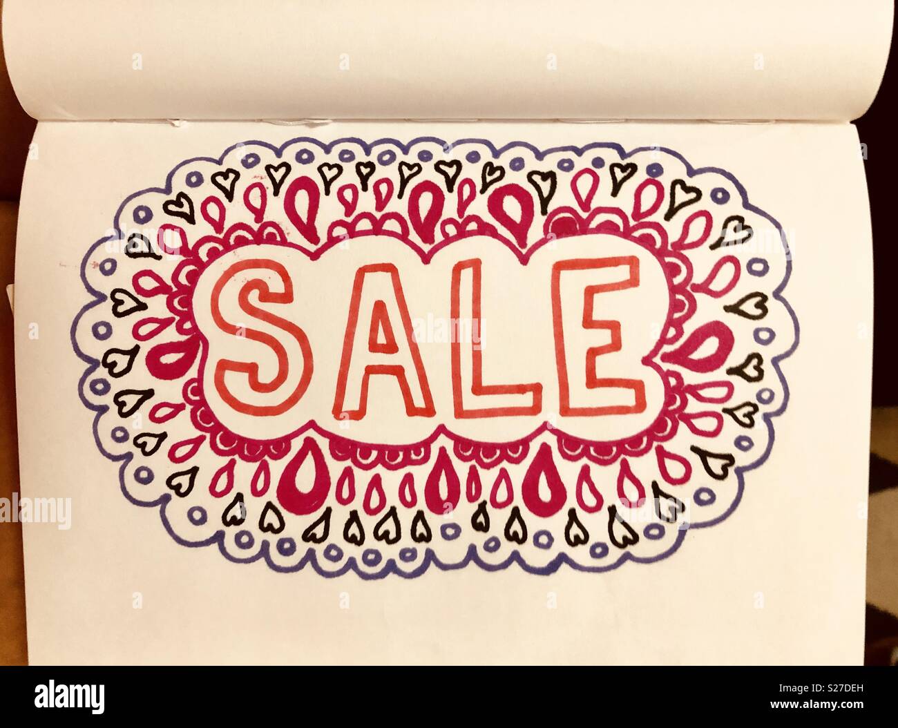 Verkauf doodle Zeichen - Smartphone-aufgenommenes Stockfoto