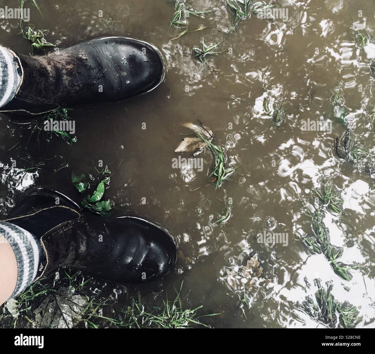 Stiefel in der Regen Stockfoto