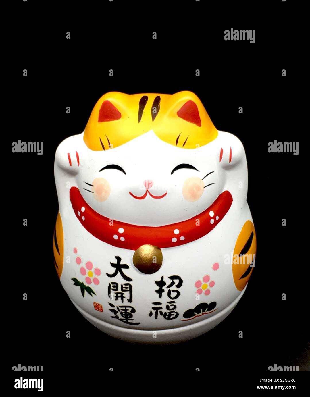 Japanische Maneki Neko Glückskatze Stockfoto