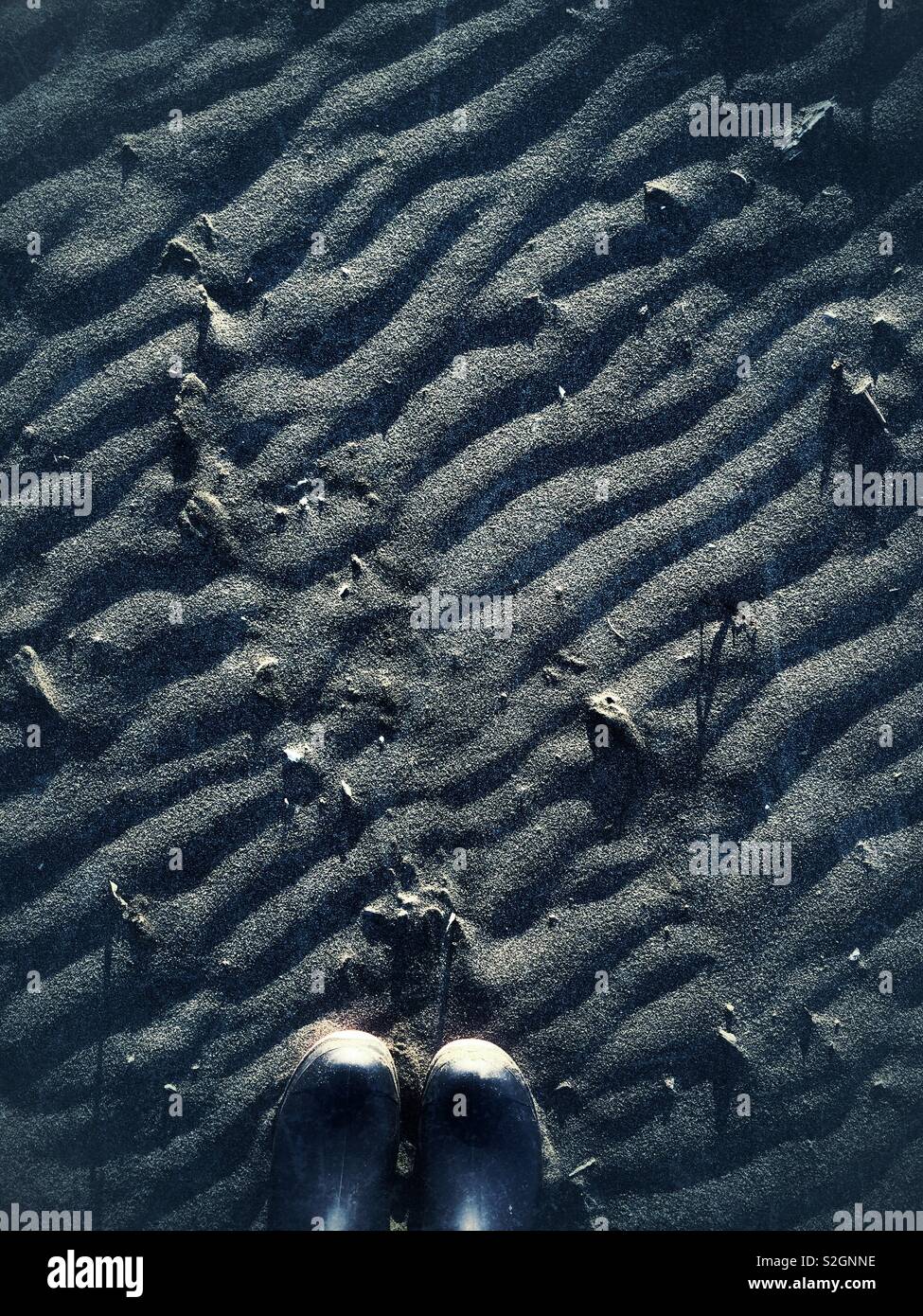 Wellies am Strand Stockfoto