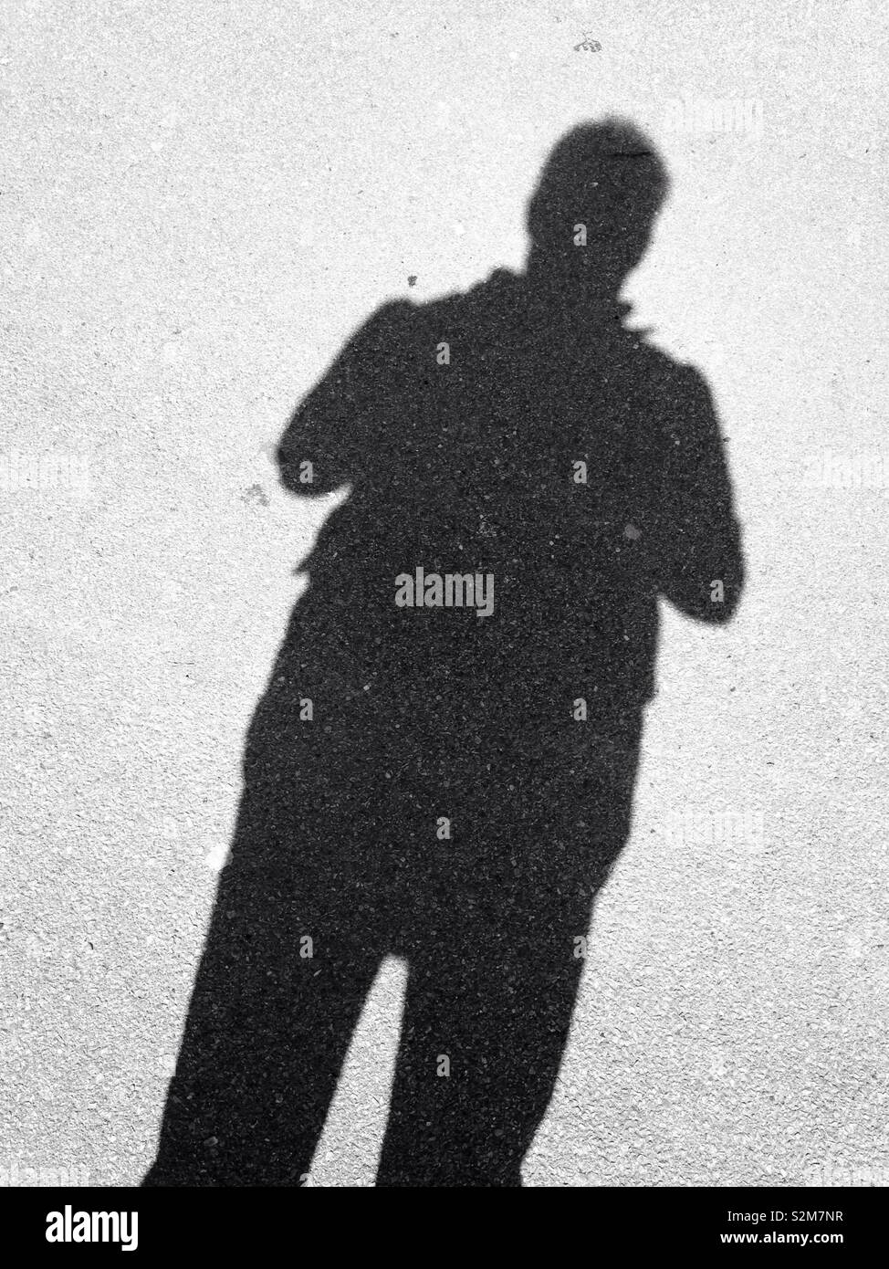 Schatten eines Mannes - Smartphone-aufgenommenes Stockfoto