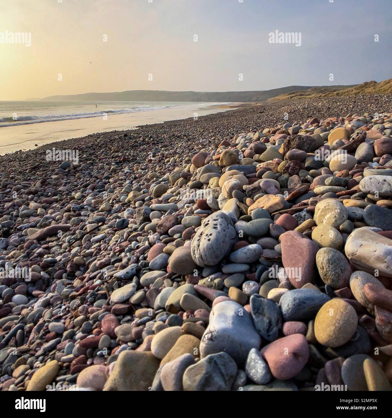 Kieselsteine am Strand Stockfoto