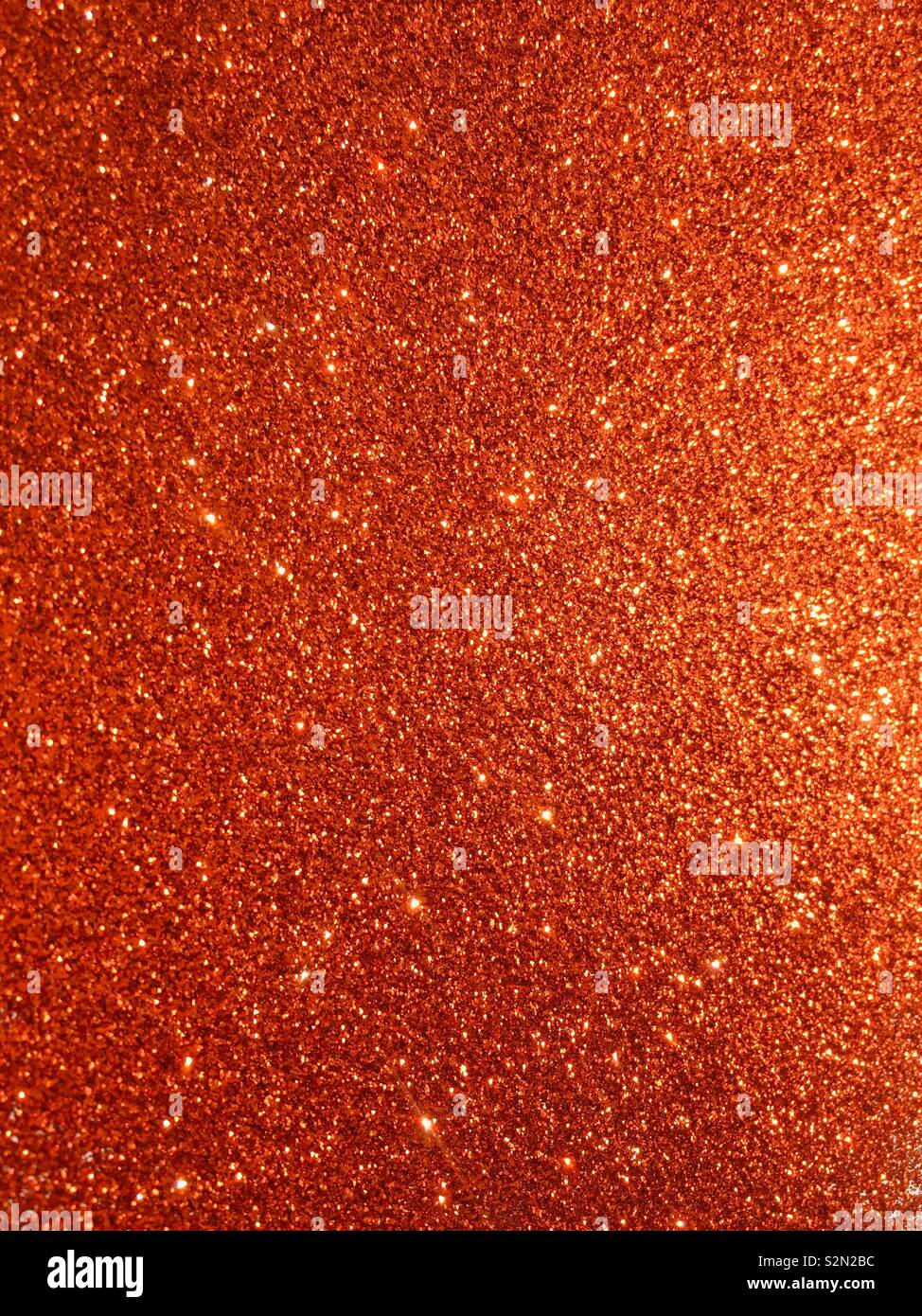Orange glitter Textur und Glanz Weihnachten abstrakt Hintergrund Stockfoto