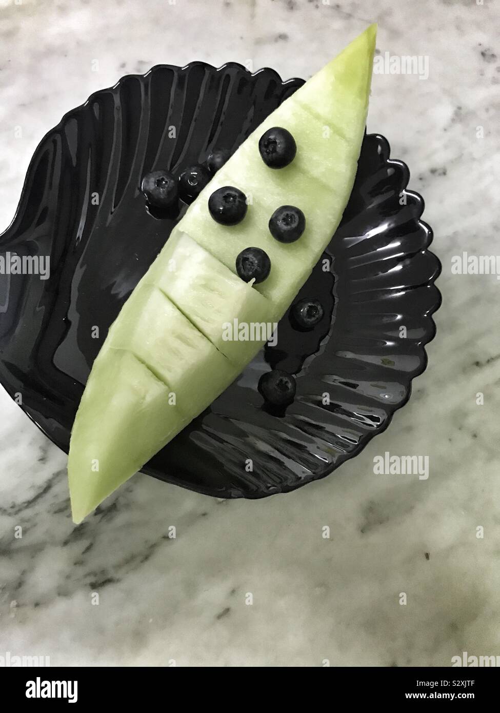 Detox Früchte: Honigmelone und Blaubeeren Stockfoto