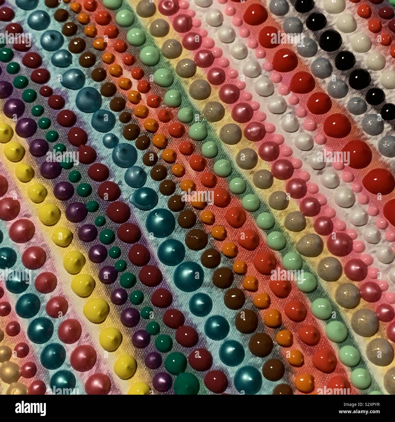 Eine bunte Palette von farbigen Punkten. Stockfoto