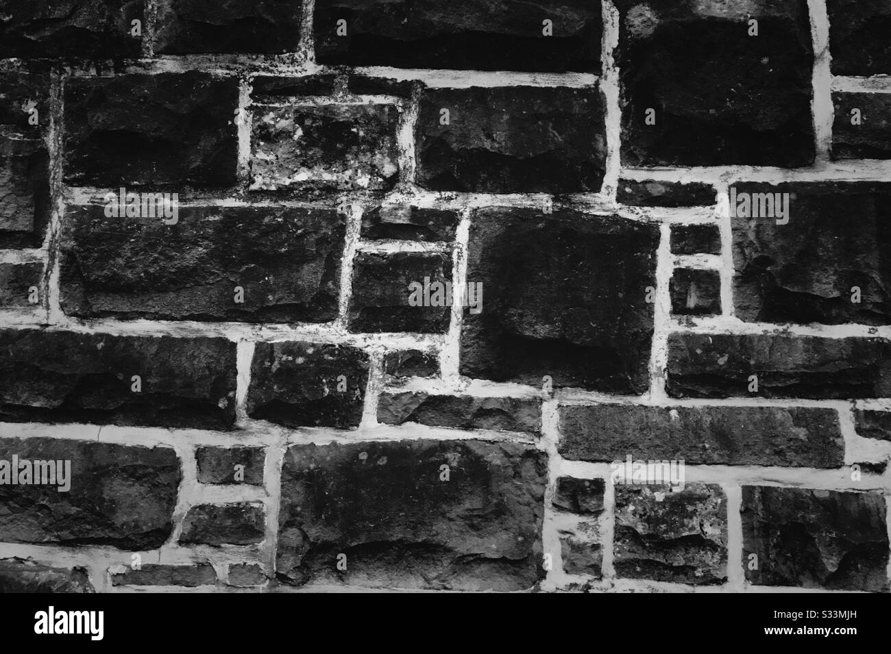 Abstrakte Steinwand. - Smartphone-aufgenommenes Stockfoto