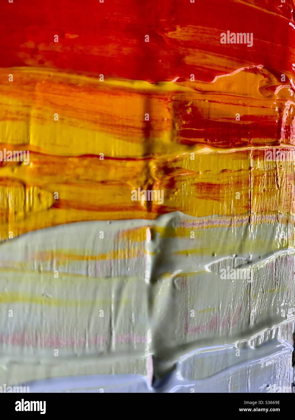 Dicke Farbe in warmen Farben Stockfoto