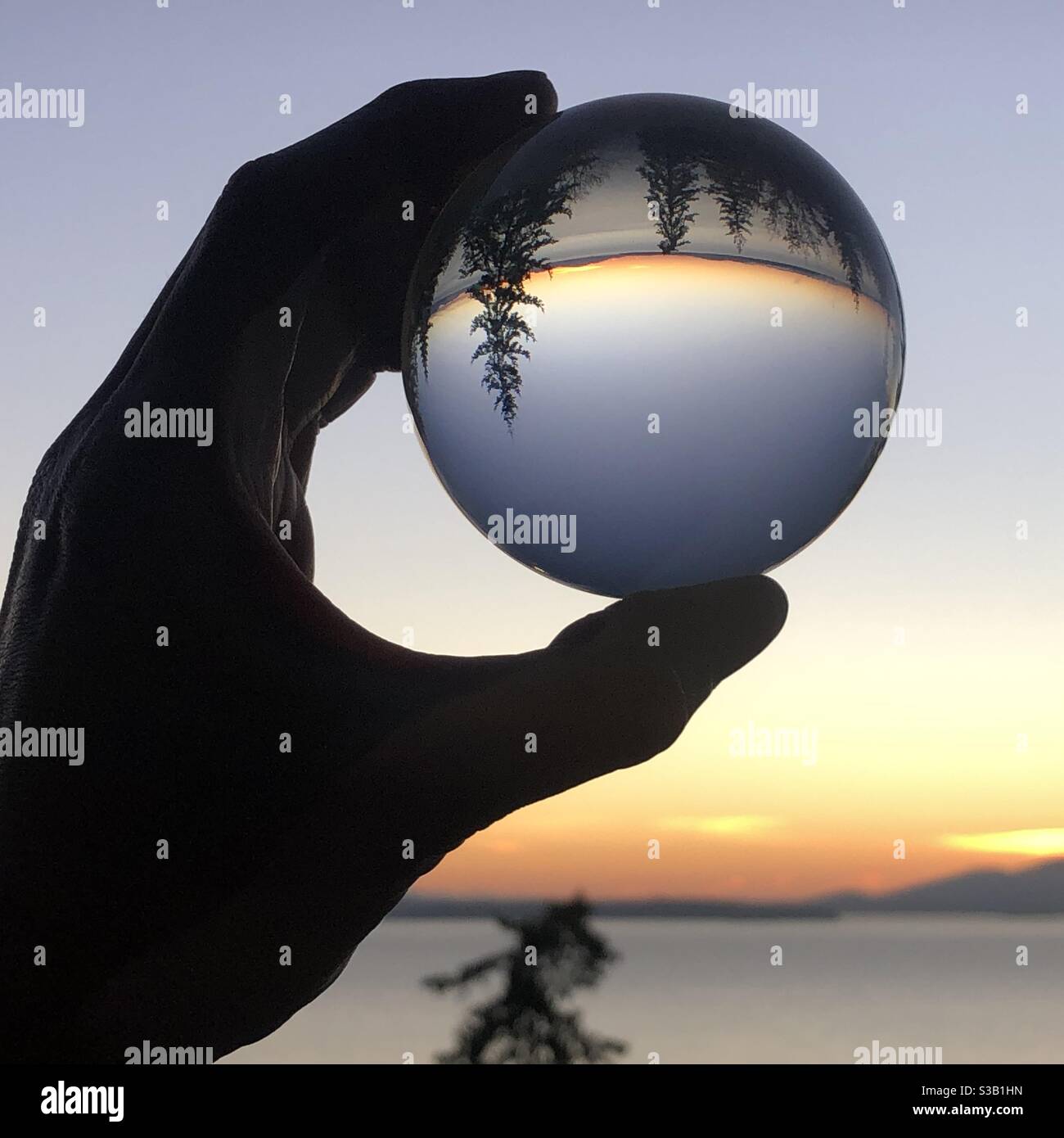 Sonnenuntergang in meiner Hand Stockfoto