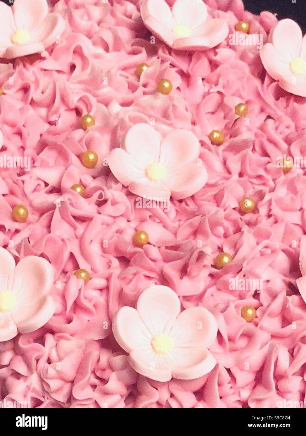 Süßer rosa Blumenkuchen Stockfoto