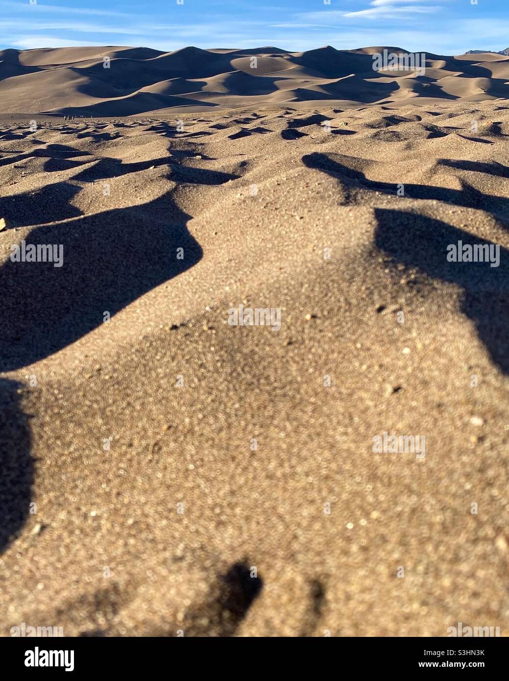 Wellen im sand Stockfoto