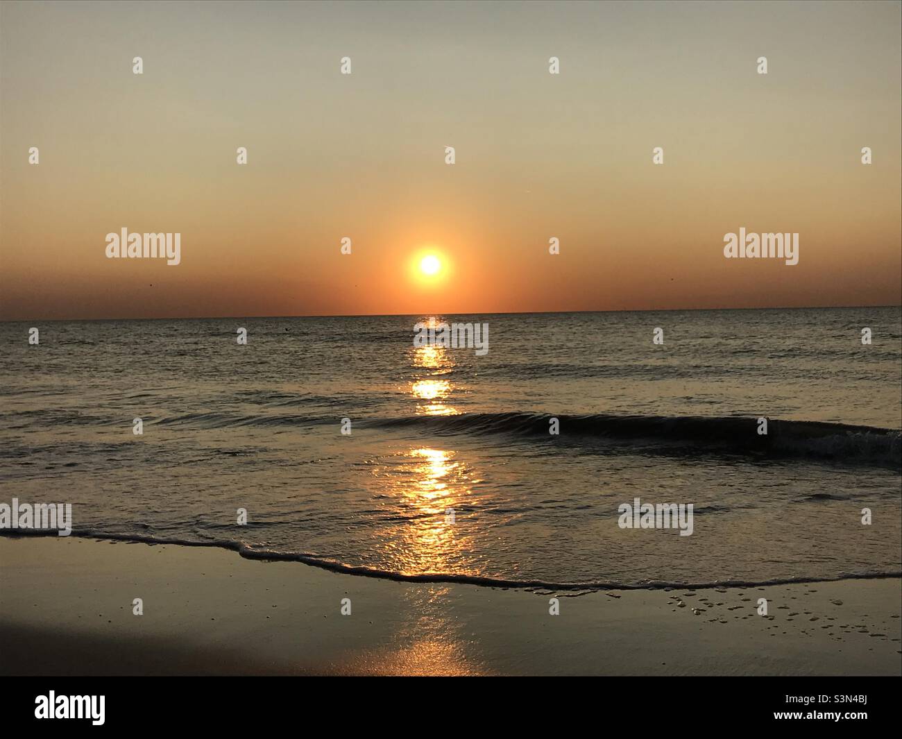 Strand Sonnenuntergang - Smartphone-aufgenommenes Stockfoto