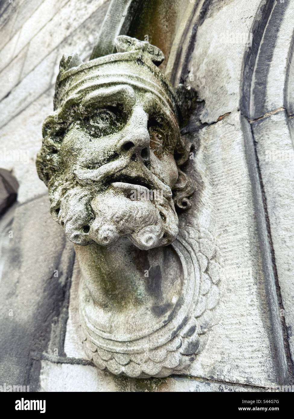 Skulptur eines Mannes Gesicht, das in die Mauer von Dublin Castle in Dublin, Irland, geschnitzt wurde. Stockfoto