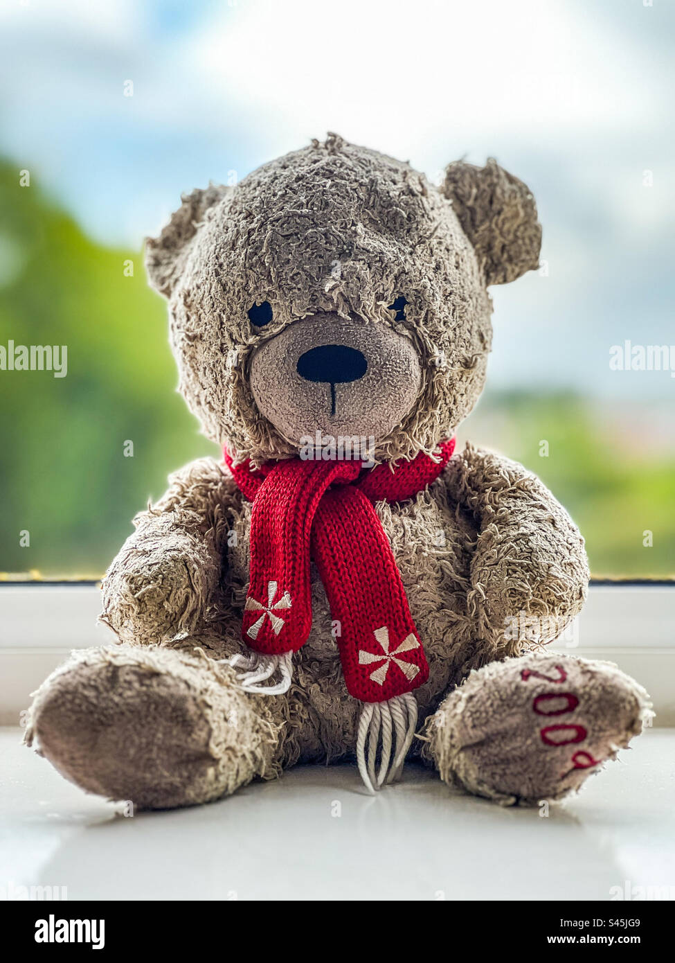 Alter gebrauchter Kinderteddy Stockfoto