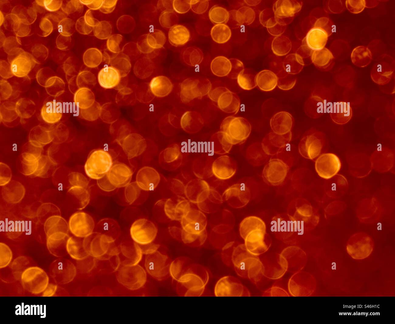 Orange Glitter-Hintergrund - Smartphone-aufgenommenes Stockfoto