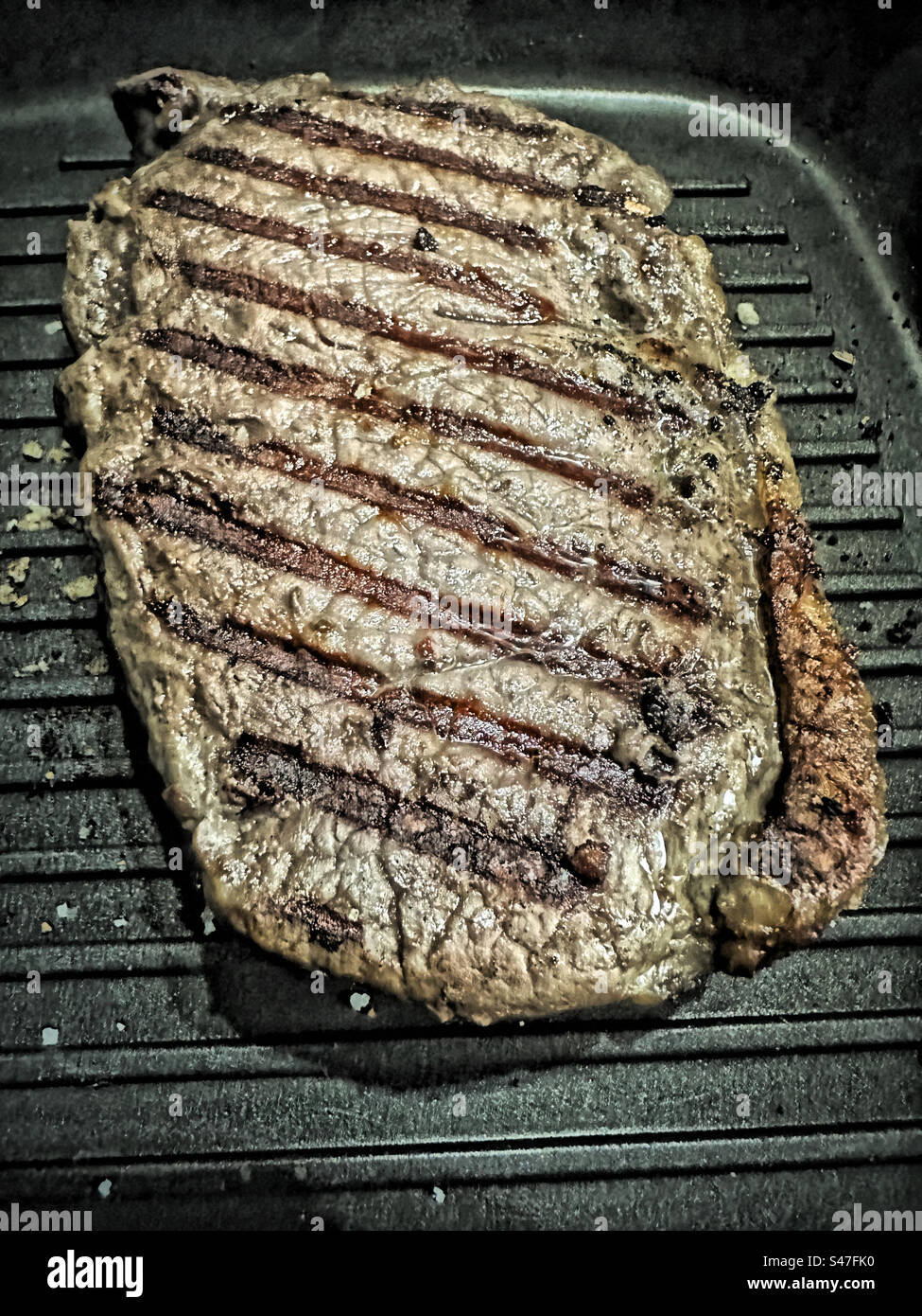 Big Daddy Steak in einer Grillpfanne grillen Stockfoto