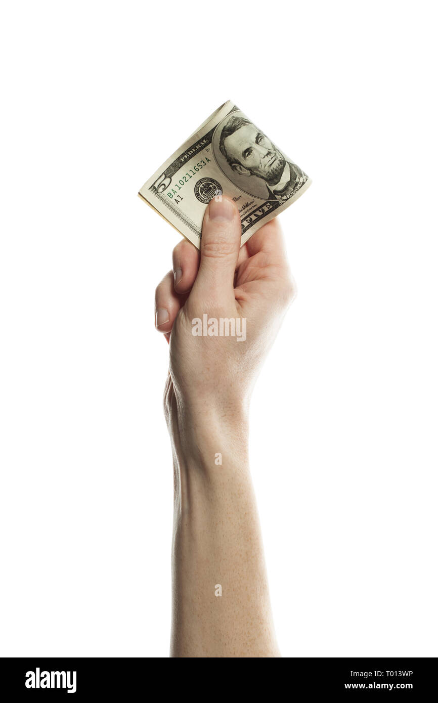Fünf US-Dollar Bargeld in männlicher Hand auf weißem Hintergrund. US-Dollar Banknoten zu 5 Stockfoto