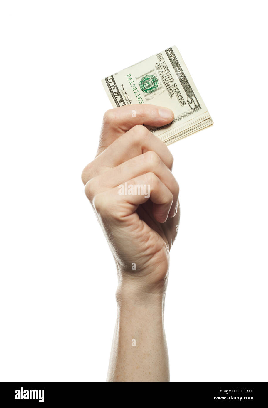 5 Amerikanische Dollar in der Hand auf weißem Hintergrund, geschäftliche und finanzielle Konzept Stockfoto