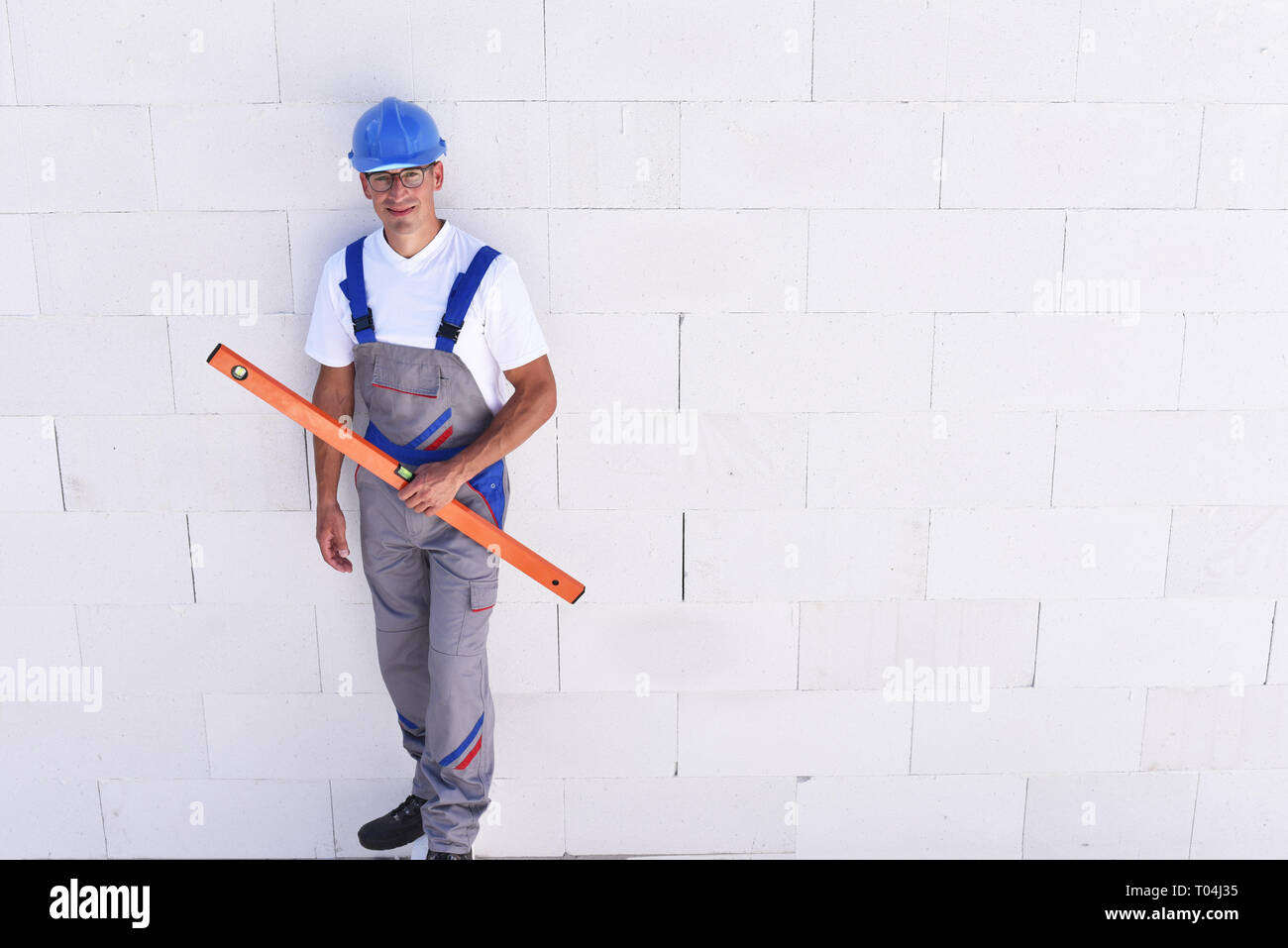 Beruf Bauarbeiter - Arbeiten auf der Baustelle der Bau eines Wohnhauses Stockfoto
