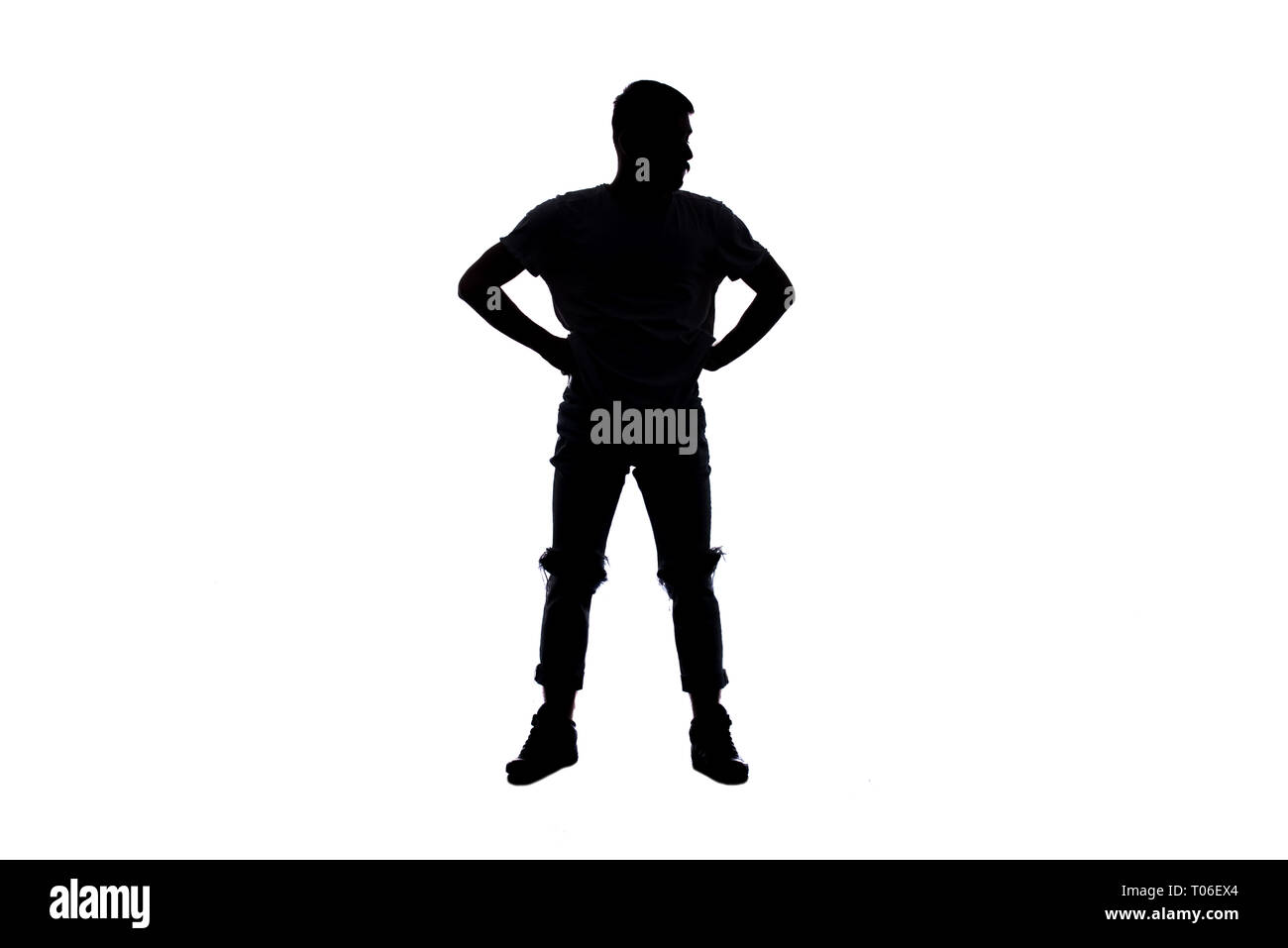 Silhouette von einem jungen Mann, der das tut Breakdance Stockfoto