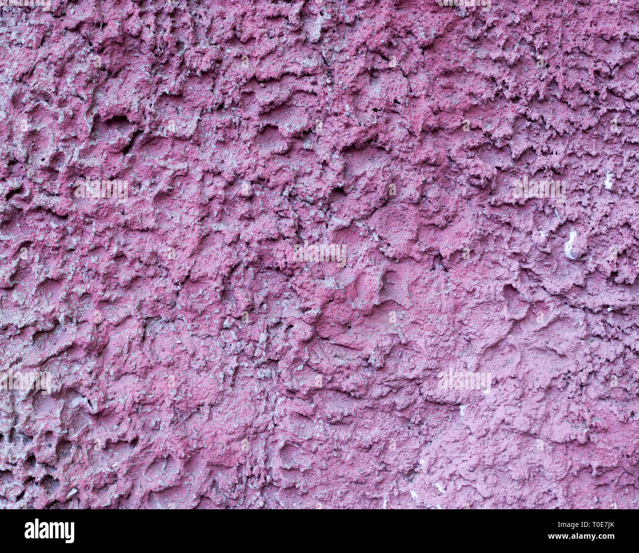 Rosa bemalten Relief an der Wand. Hintergrund, Textur. Stockfoto