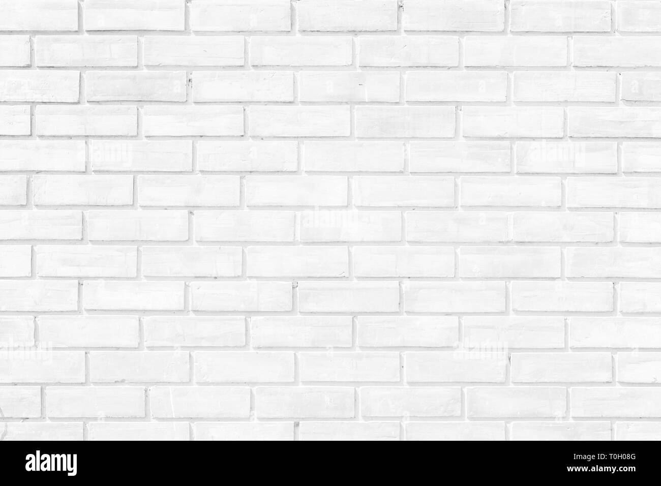 Weiße Mauer Textur Hintergrund. Mauerwerk oder Mauerwerk Bodenbeläge innen Rock alte Muster sauber konkrete Grid unebener Ziegel Design. Stockfoto