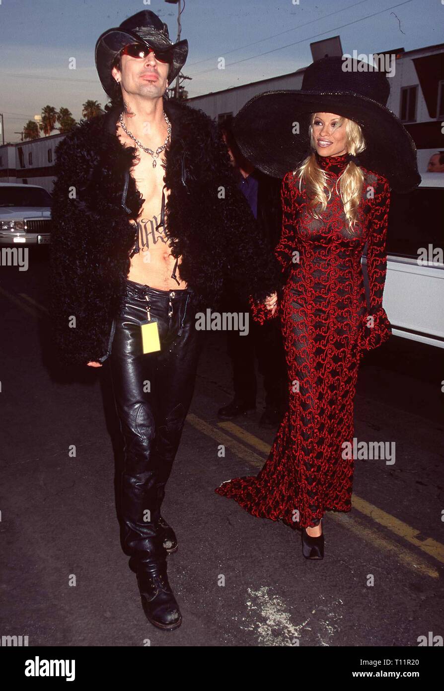 LOS ANGELES, Ca. Januar 27, 1997: Baywatch star Pamela Anderson Lee & Ehemann Tommy Lee bei den American Music Awards in Los Angeles. Stockfoto