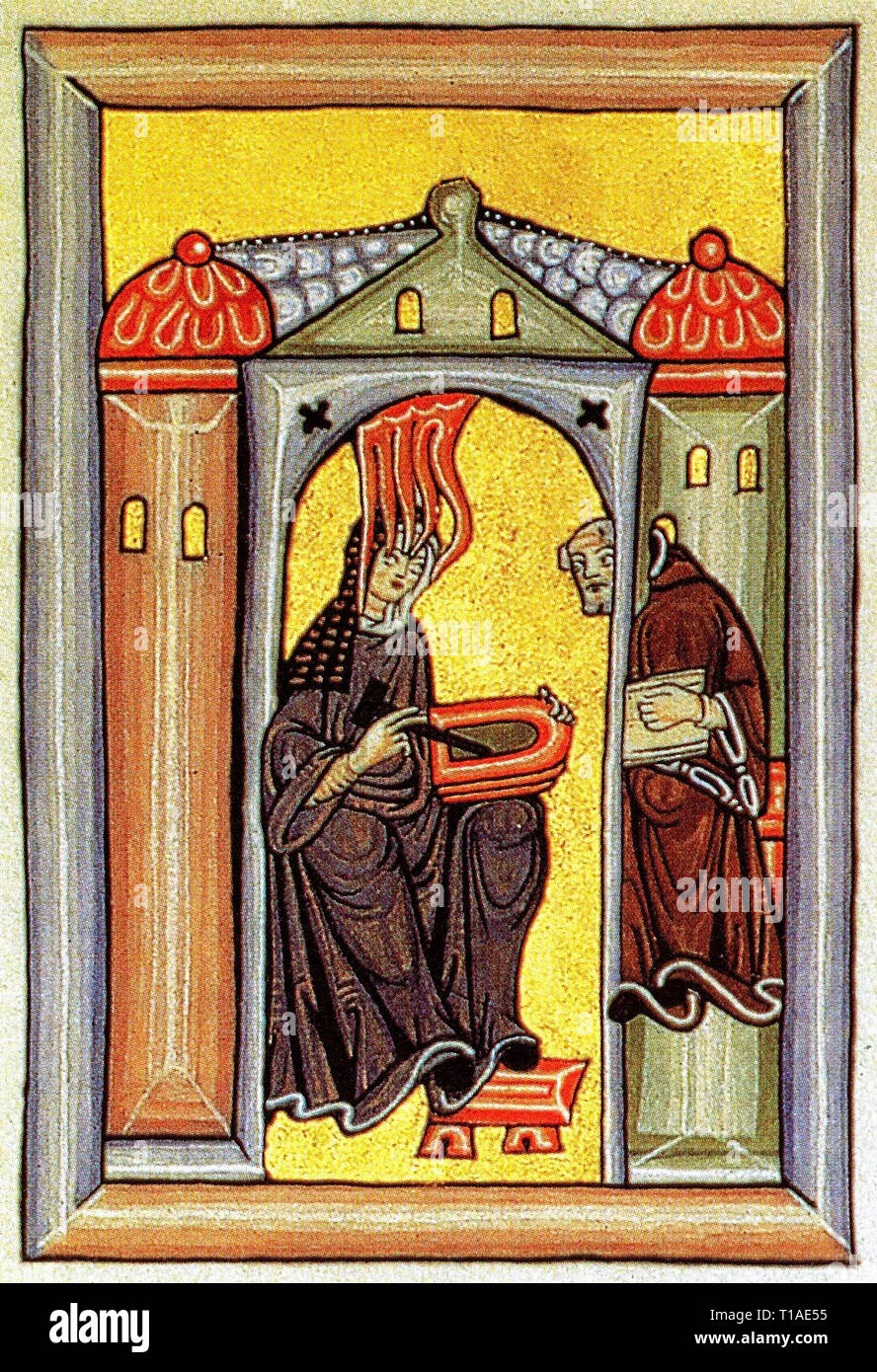 Hildegard von Bingen erhält eine göttliche Inspiration und leitet sie an den Schreiber. Stockfoto