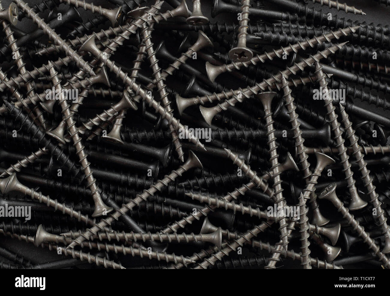 Bau, bei der Instandsetzung, Werkzeuge - Abstrakte selbstschneidende Schraube Hintergrund Stockfoto