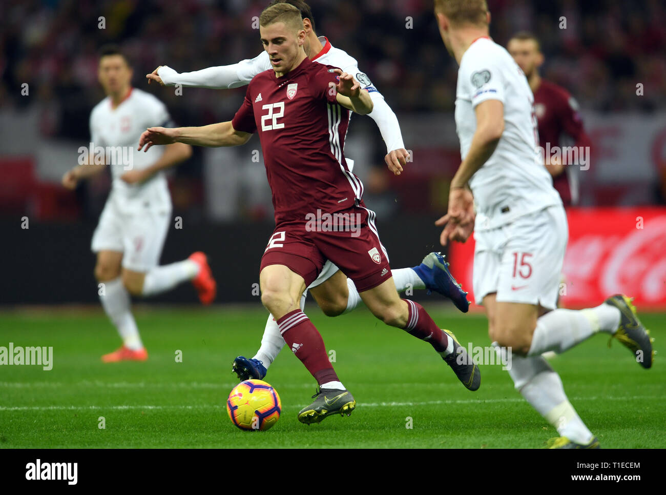 Warschau. 24 Mär, 2019. Vladislavs Gutkovskis von Lettland (22) konkurriert während der UEFA EURO 2020 Gruppe B qualifikationsspiel zwischen Polen und Lettland an der Nationalen Staidium in Warschau, 24. März 2019. Polen gewann 2-0. Credit: Maciej Gillert/Xinhua/Alamy leben Nachrichten Stockfoto