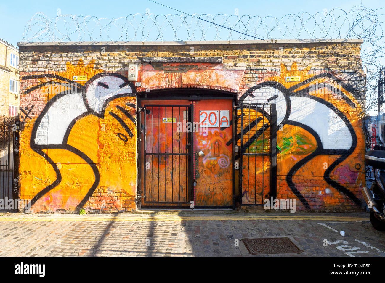 Street Art an einer Fassade in Shoreditch - East London, England Stockfoto
