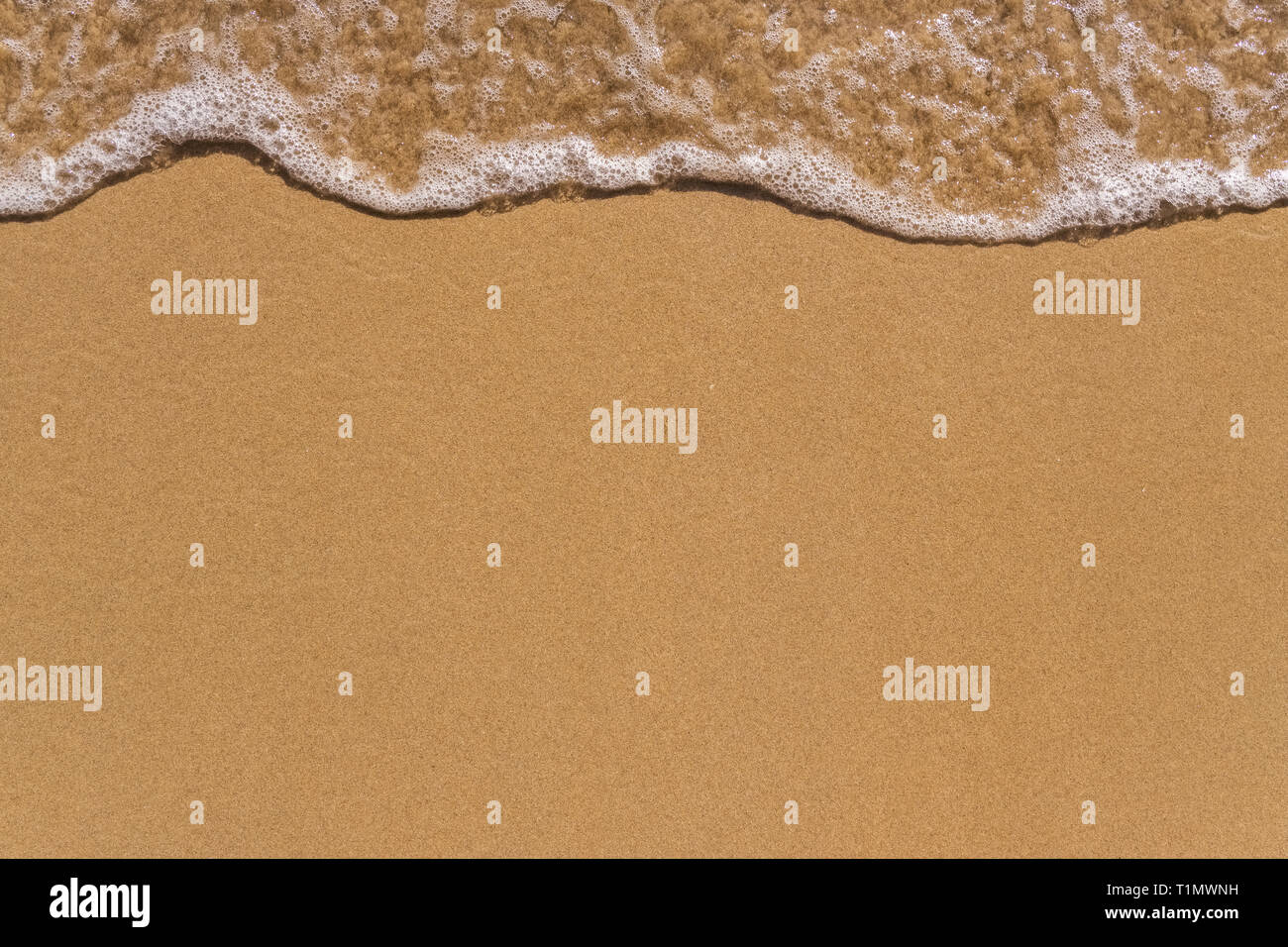 Welle auf dem Sand strand Hintergrund Nahaufnahme Stockfoto