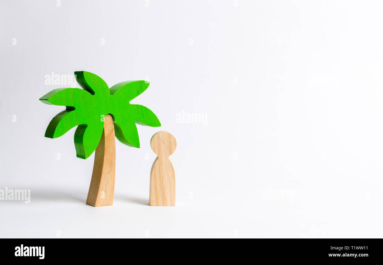 Die Abbildung der Person kosten unter einem Holz- Palme auf einem weißen Hintergrund. Urlaub oder Reise. Auf einer einsamen Insel gestrandet. Persönlicher Raum und moralischen re Stockfoto