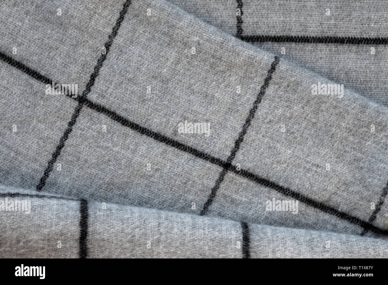 Blick von oben auf die Textur von grauer Stoff in einem großen Käfig Stockfoto