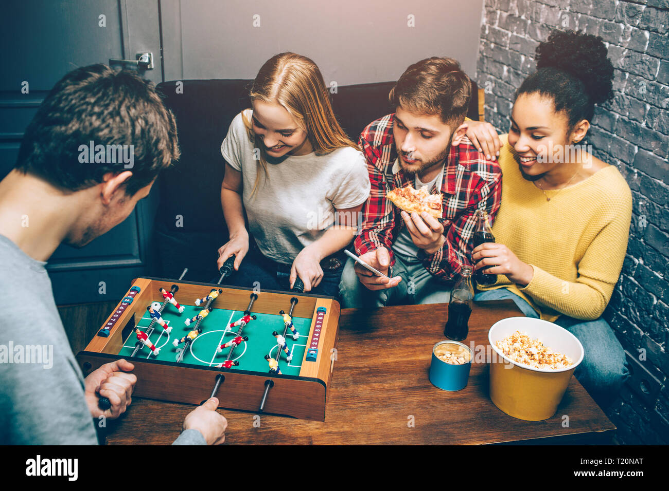 Teenage boy playing football. мальчик играет с мечём. друзья с гитарой. дети играют в мяч. эмоции игромана.