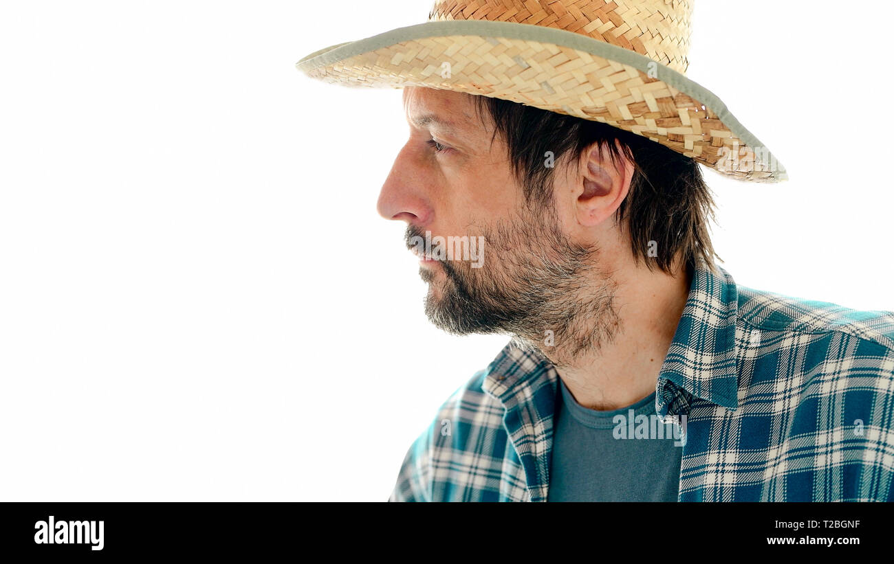 Portrait von nachdenklich Landwirt in nachdenklicher Pose auf weißem Hintergrund. Stockfoto