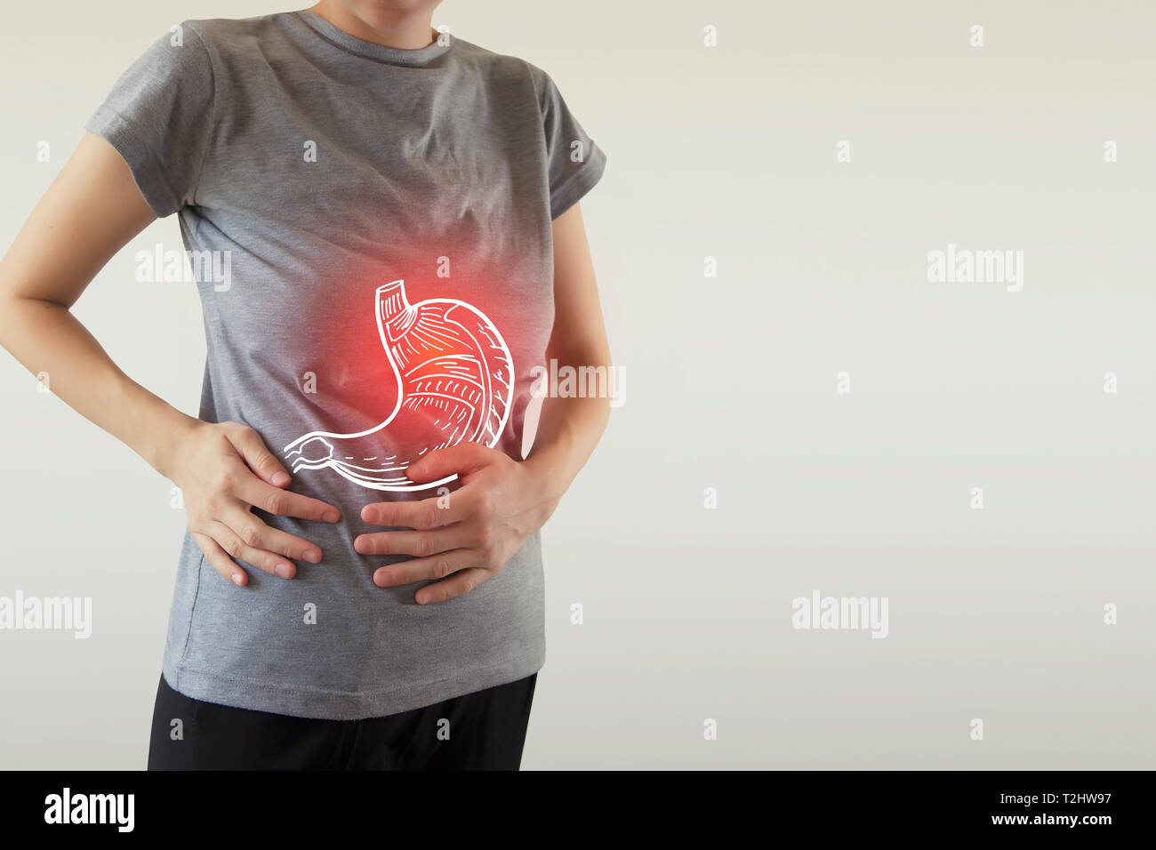 Digital composite der roten Schmerzen im Bauch der Frau hervorgehoben Stockfoto