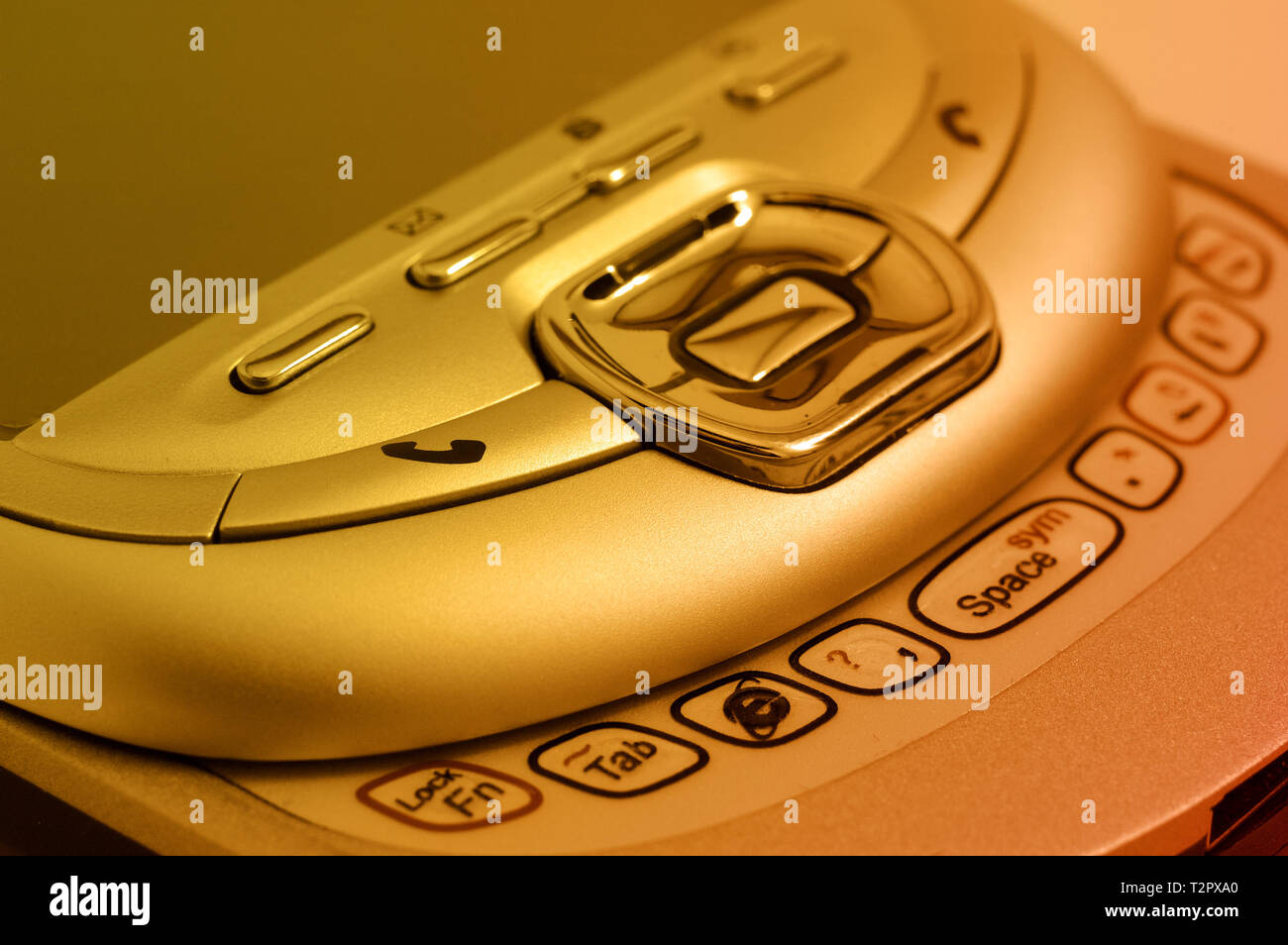 PDA. Alte Handy. Bild in orange Tönung Stockfoto
