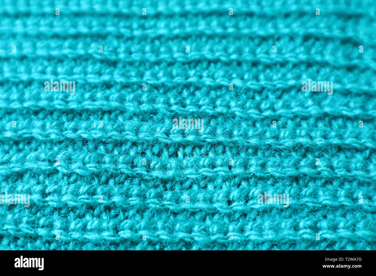 Geschlossen bis Textur von Türkis Blau Alpaka gestrickte Wolle Stoff in horizontalen Muster Stockfoto