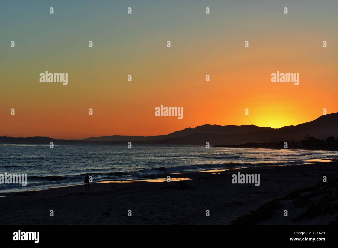 Sonnenuntergang am Strand Stockfoto