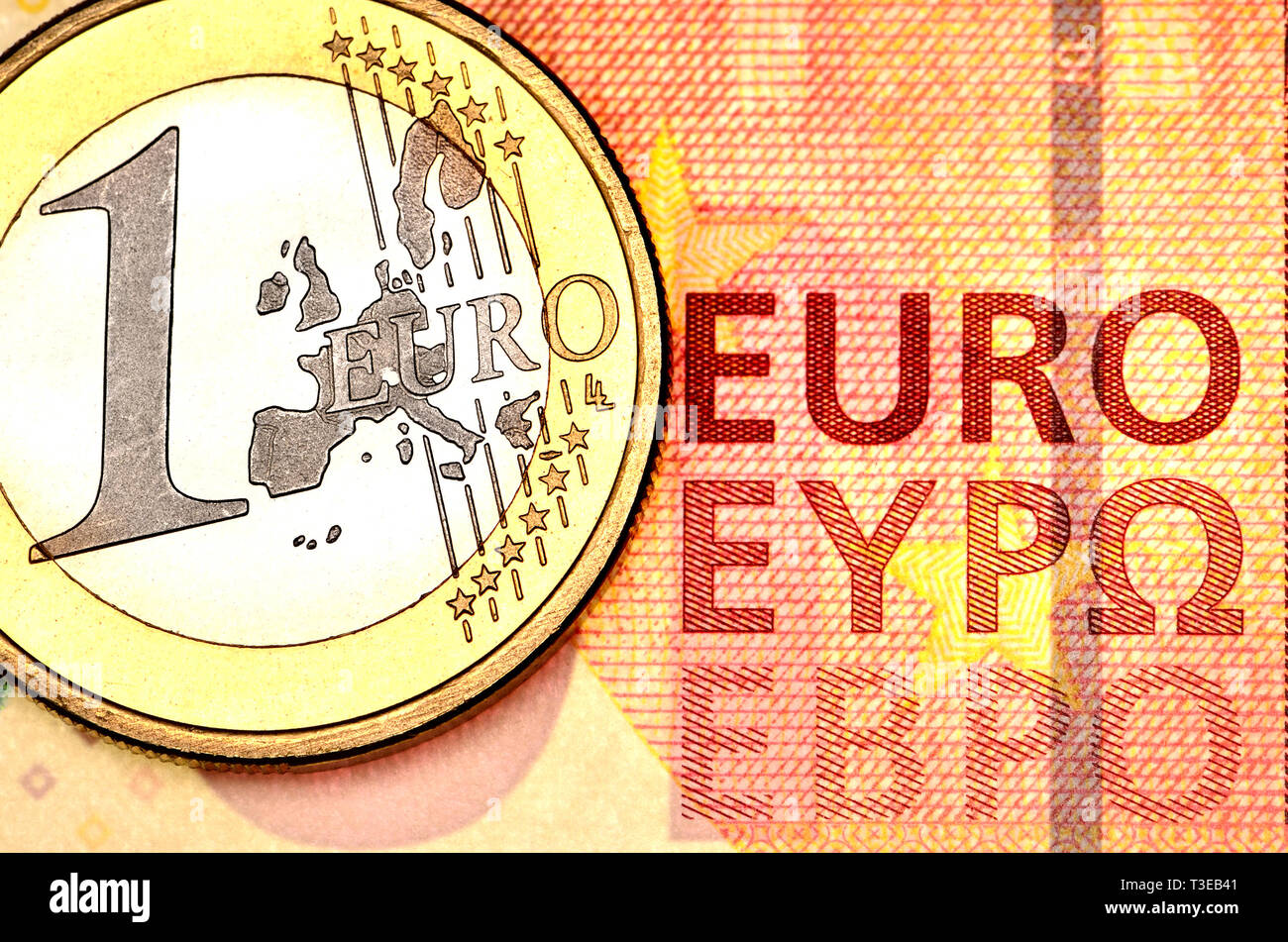 1 Euro Münze auf 10 Euro Hinweis Stockfoto