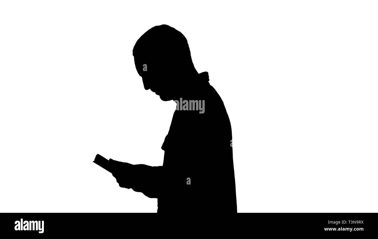 Silhouette Tablet Computer. Seitenansicht mit digitalen tablet Mann. Stockfoto
