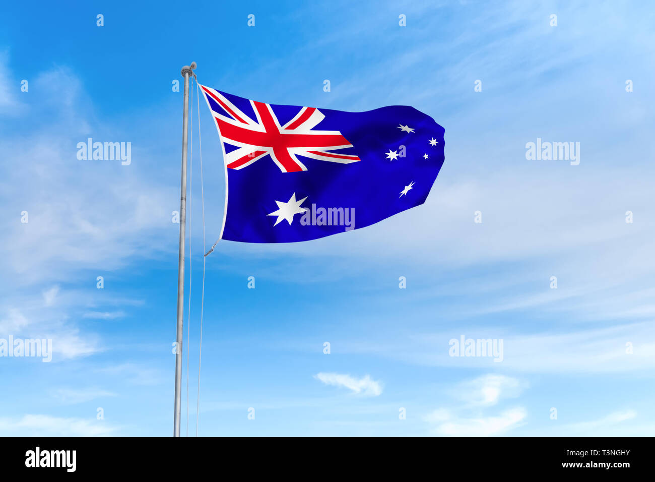 Australien Flagge weht im Wind über blauen Himmel Hintergrund Stockfoto