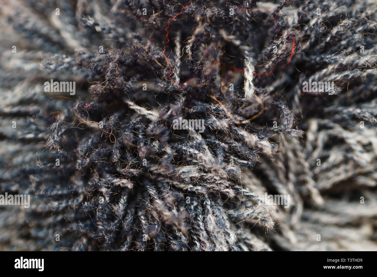 Grau Pompon makroökonomische Bild. Zusammenfassung Hintergrund des Strickens Elemente Stockfoto