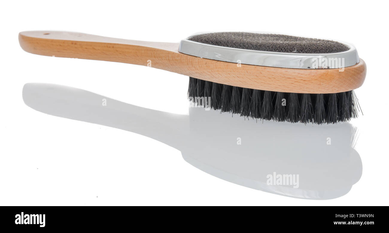 Eine Kleiderbürste und Flusen entferner Bürste Kombination auf einem isolierten Stockfoto