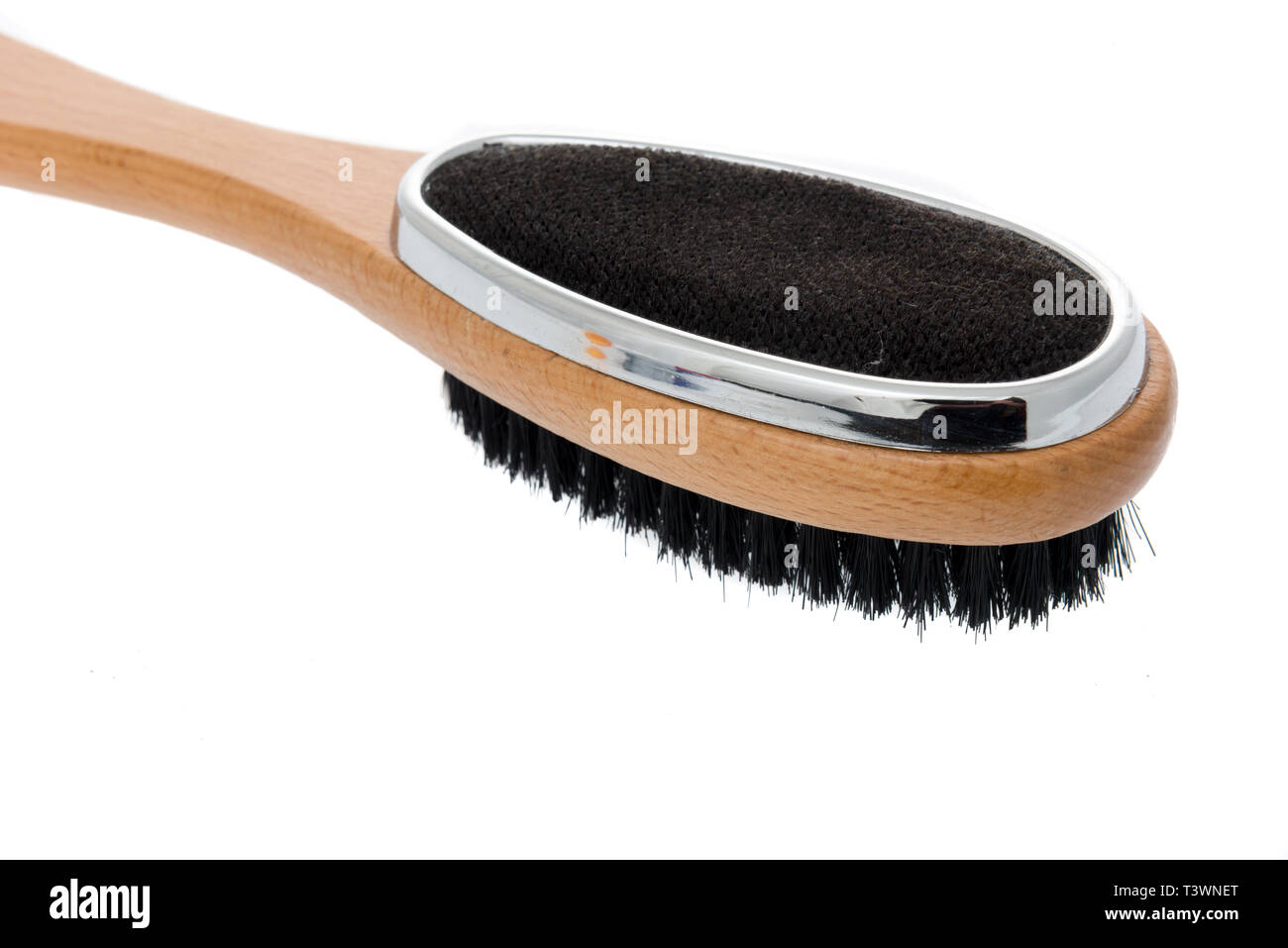 Eine Kleiderbürste und Flusen entferner Bürste Kombination auf einem isolierten Stockfoto
