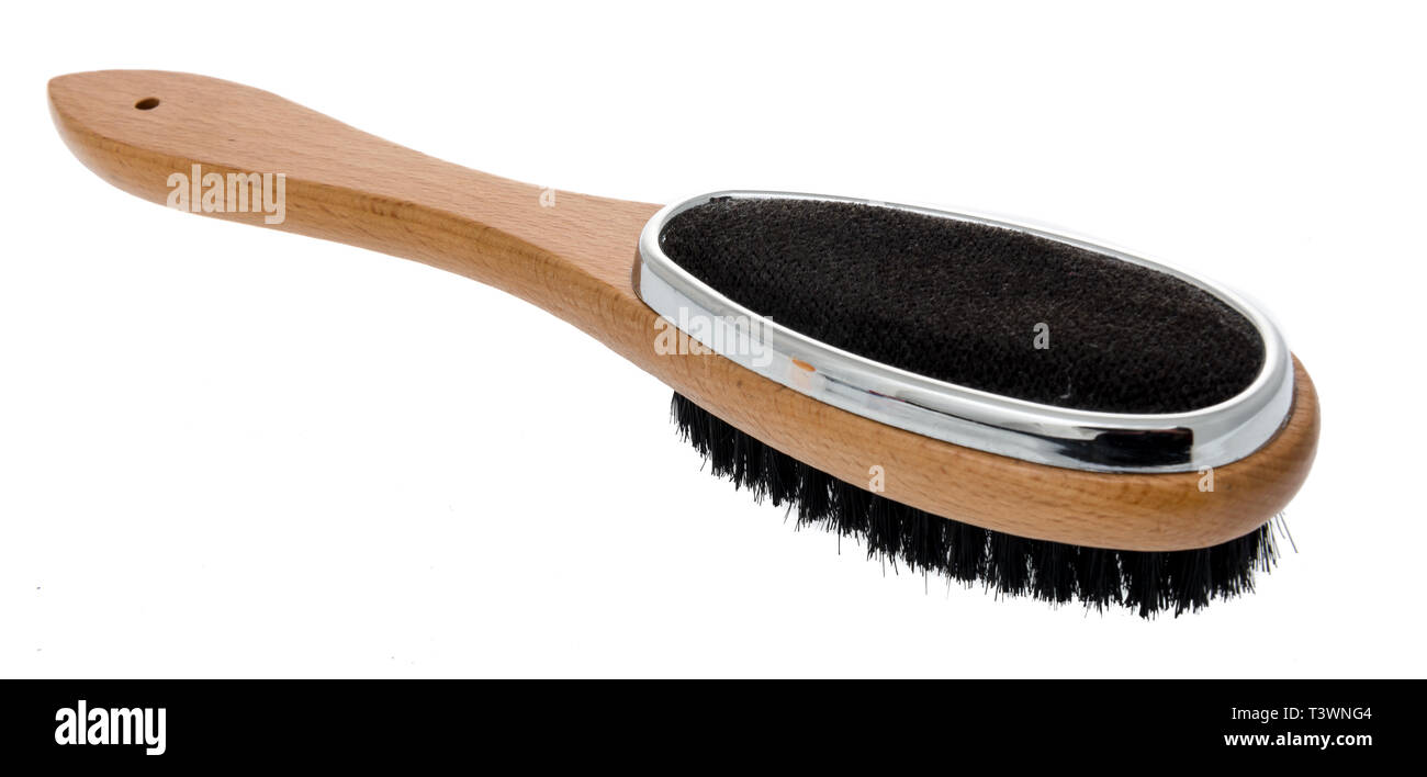 Eine Kleiderbürste und Flusen entferner Bürste Kombination auf einem isolierten Stockfoto